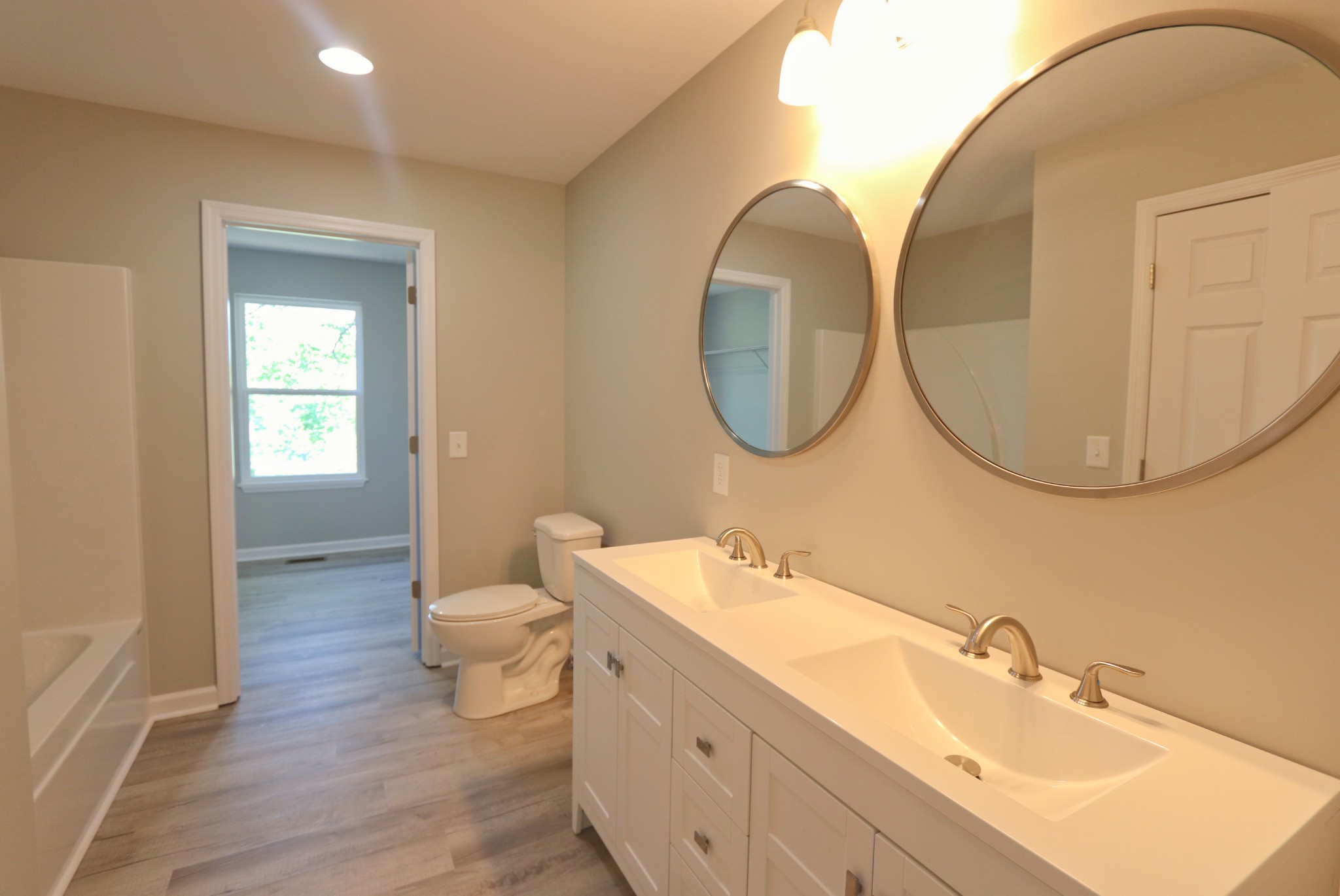 512 Highland Park Road Red Boiling Springs, TN 37150 - Photo 10 of 18 a bathroom with a double vanity sink and a mirror