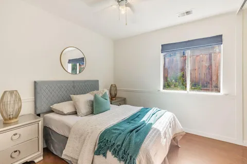 a bedroom with bed and window