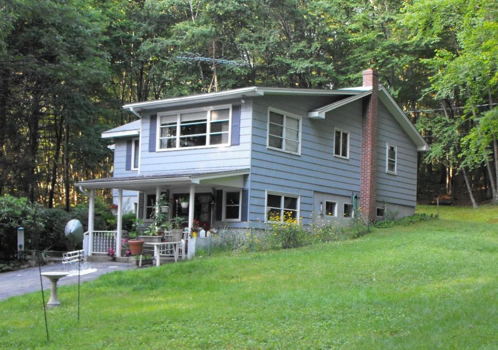 237 B Brick Top Road Windham, CT 06280 - Photo 1 of 1 a front view of a house with a garden and patio