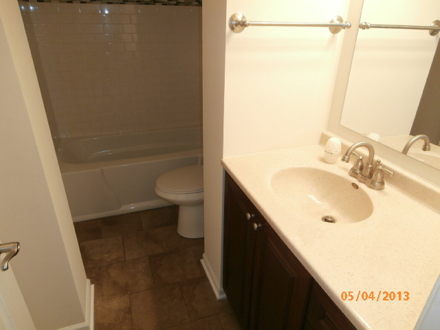 334 Rodenburg Road Roselle, IL 60172 - Photo 11 of 14 a bathroom with a sink and a mirror