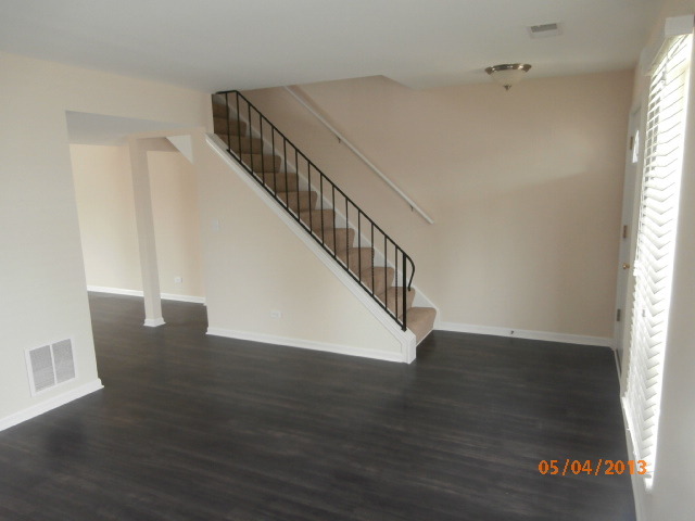 334 Rodenburg Road Roselle, IL 60172 - Photo 4 of 14 a view of entryway and hall with wooden floor