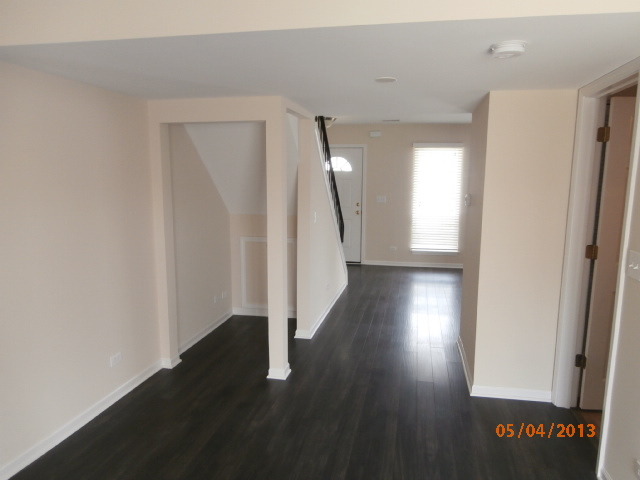 334 Rodenburg Road Roselle, IL 60172 - Photo 8 of 14 a view of a hallway with wooden floor