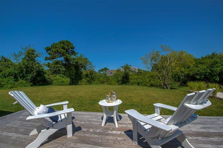 a view of a lake with furniture