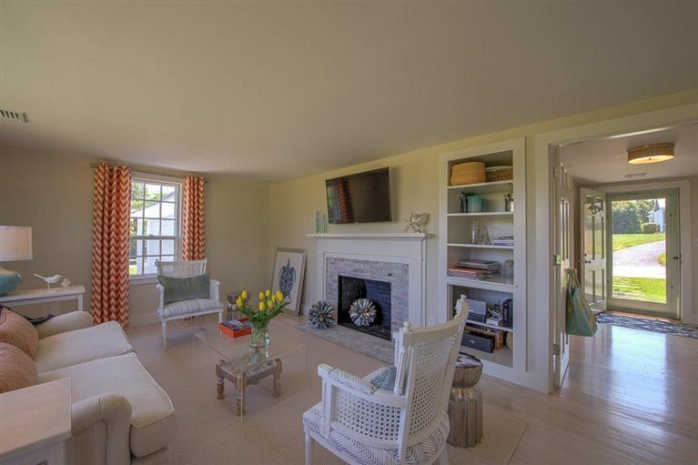 12 Salten Point Road Barnstable, MA 02630 - Photo 13 of 33 a living room with furniture and a fireplace