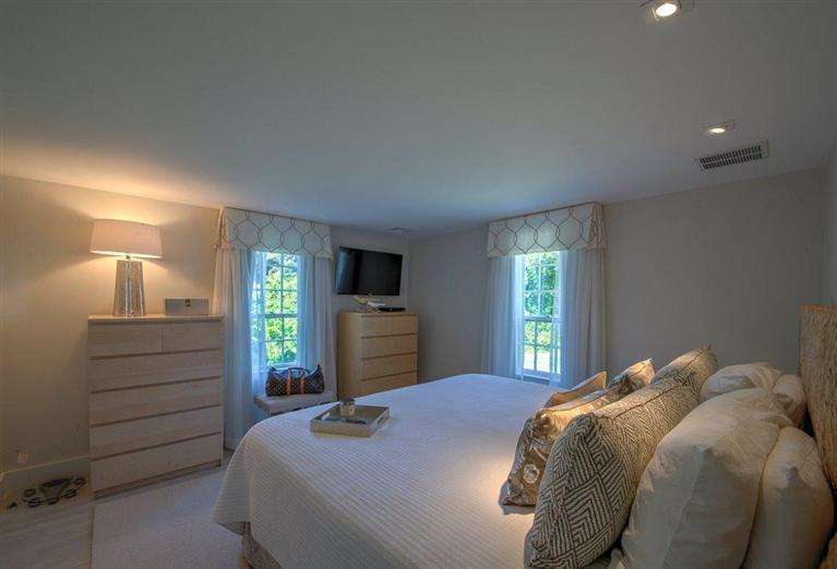 12 Salten Point Road Barnstable, MA 02630 - Photo 15 of 33 a bedroom with a bed and a television