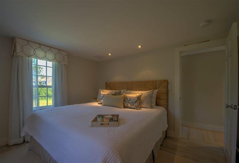 12 Salten Point Road Barnstable, MA 02630 - Photo 16 of 33 a bed sitting in a bedroom next to a window