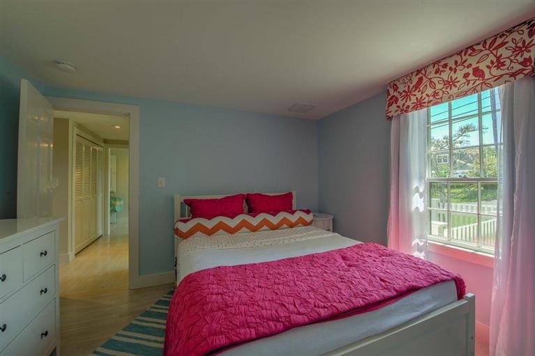 12 Salten Point Road Barnstable, MA 02630 - Photo 18 of 33 a bedroom with a bed and window