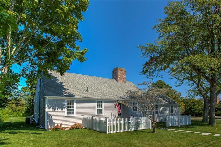 12 Salten Point Road Barnstable, MA 02630 - Photo 23 of 33 a front view of a house with a garden and trees