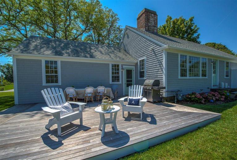 12 Salten Point Road Barnstable, MA 02630 - Photo 24 of 33 a front view of house with yard seating and green space
