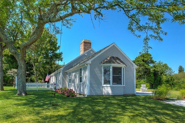 12 Salten Point Road Barnstable, MA 02630 - Photo 29 of 33 a front view of a house with a garden and trees