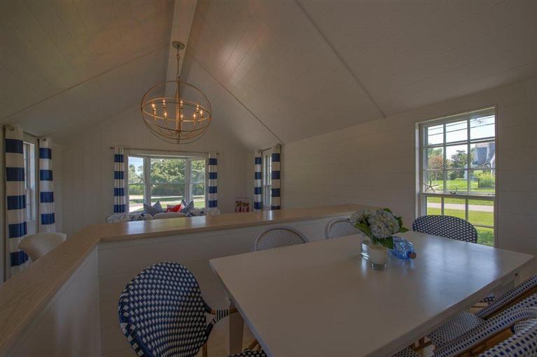 12 Salten Point Road Barnstable, MA 02630 - Photo 9 of 33 a view of a dining room with furniture a chandelier and window
