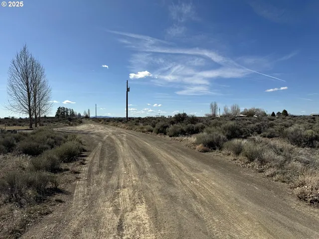 a view of a road with a building in the background
