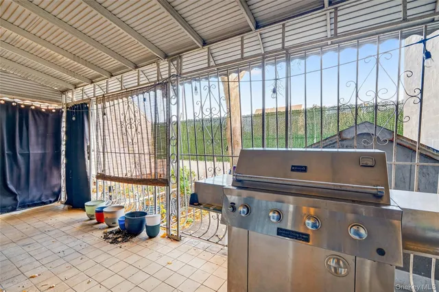 a room with furniture and large windows
