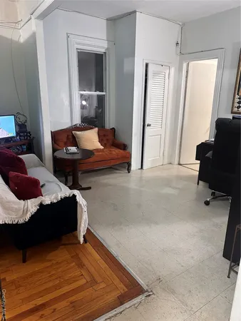 a bedroom with a bed and a chair