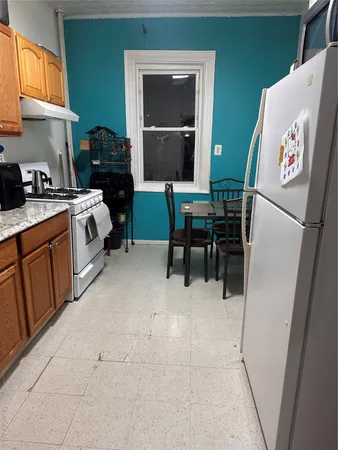 a kitchen with a sink appliances and cabinets