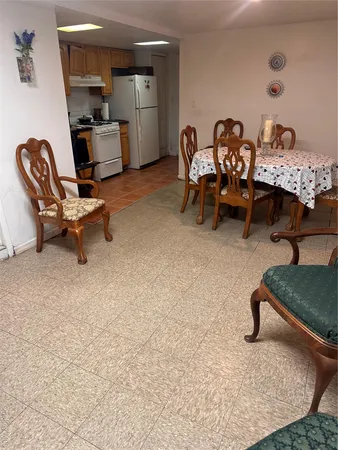a bedroom with furniture and a rug