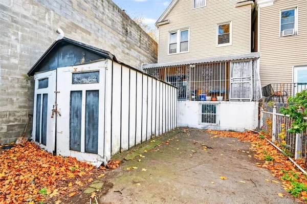 a backyard of a house with garage