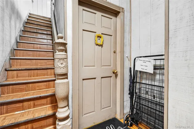 a view of entryway with wooden floor