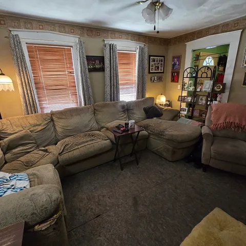 a living room with furniture and a window