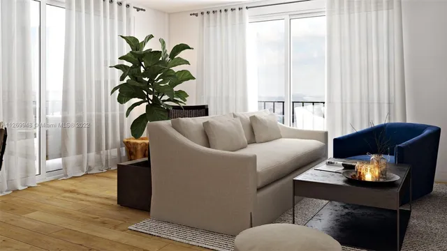 a view of a dining room with furniture and a potted plant