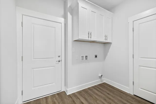 a view of an entryway with wooden floor
