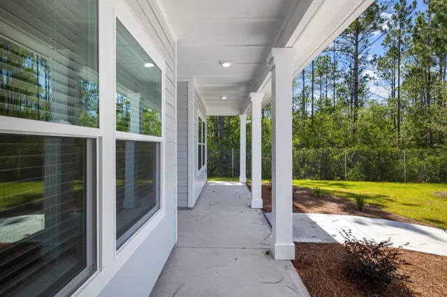 a view of a swimming pool with an outdoor seating