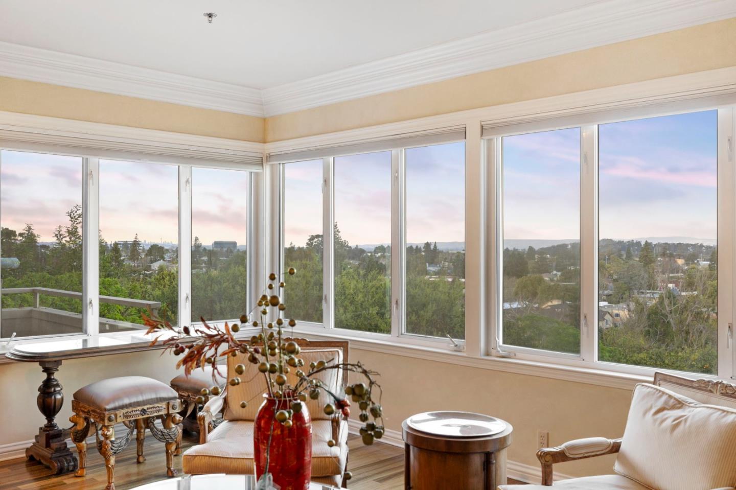24 Mounds Road, Unit A San Mateo, CA 94402 - Photo 1 of 20 a view of a city from a dining room with furniture and floor to ceiling windows