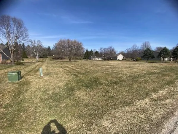 a view of a field with an outdoor space