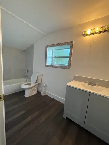 a bathroom with a toilet and a bathtub