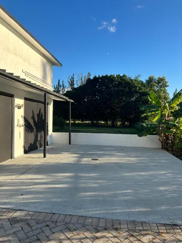 a porch with seating space and hardwood floor