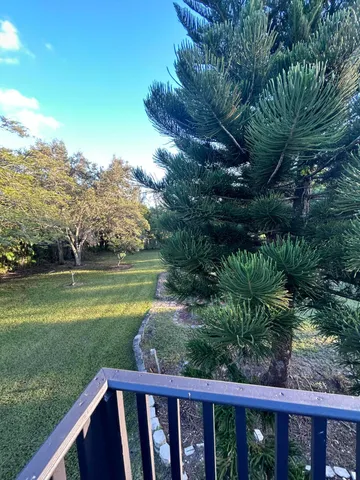 a view of balcony with furniture