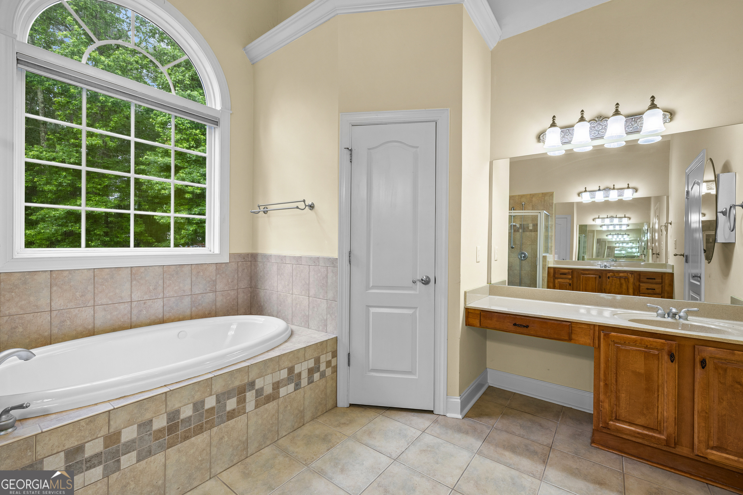 120 Shankhill Ridge Tyrone, GA 30290 - Photo 26 of 54 a bathroom with a tub a sink and a window