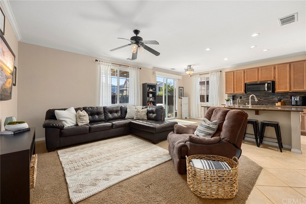 32583 Ritter Court Temecula, CA 92592 - Photo 1 of 1 a living room with furniture kitchen view and a window