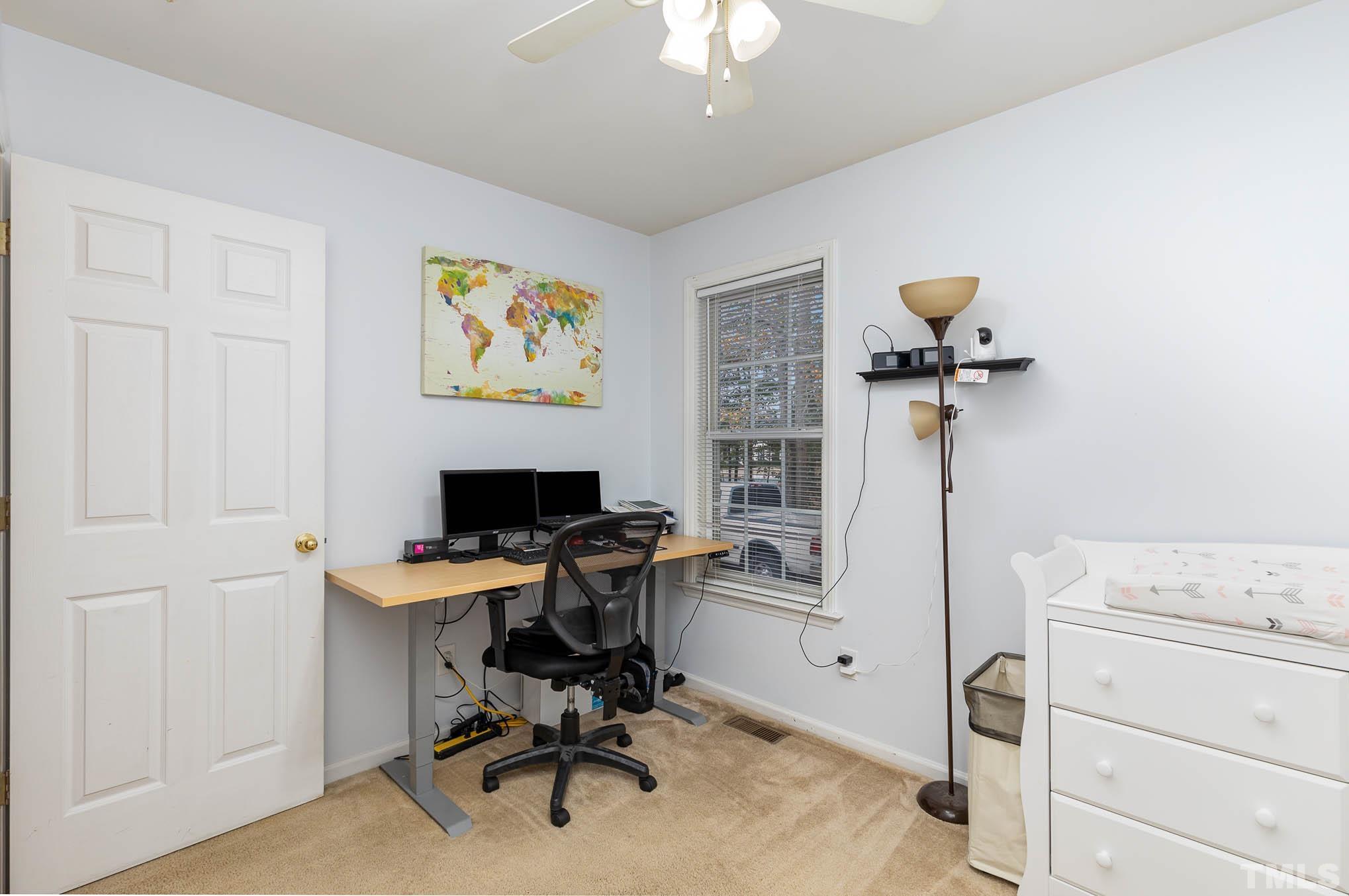 1371 Cobb Road Angier, NC 27501 - Photo 11 of 22 a view of a workspace with furniture and a window