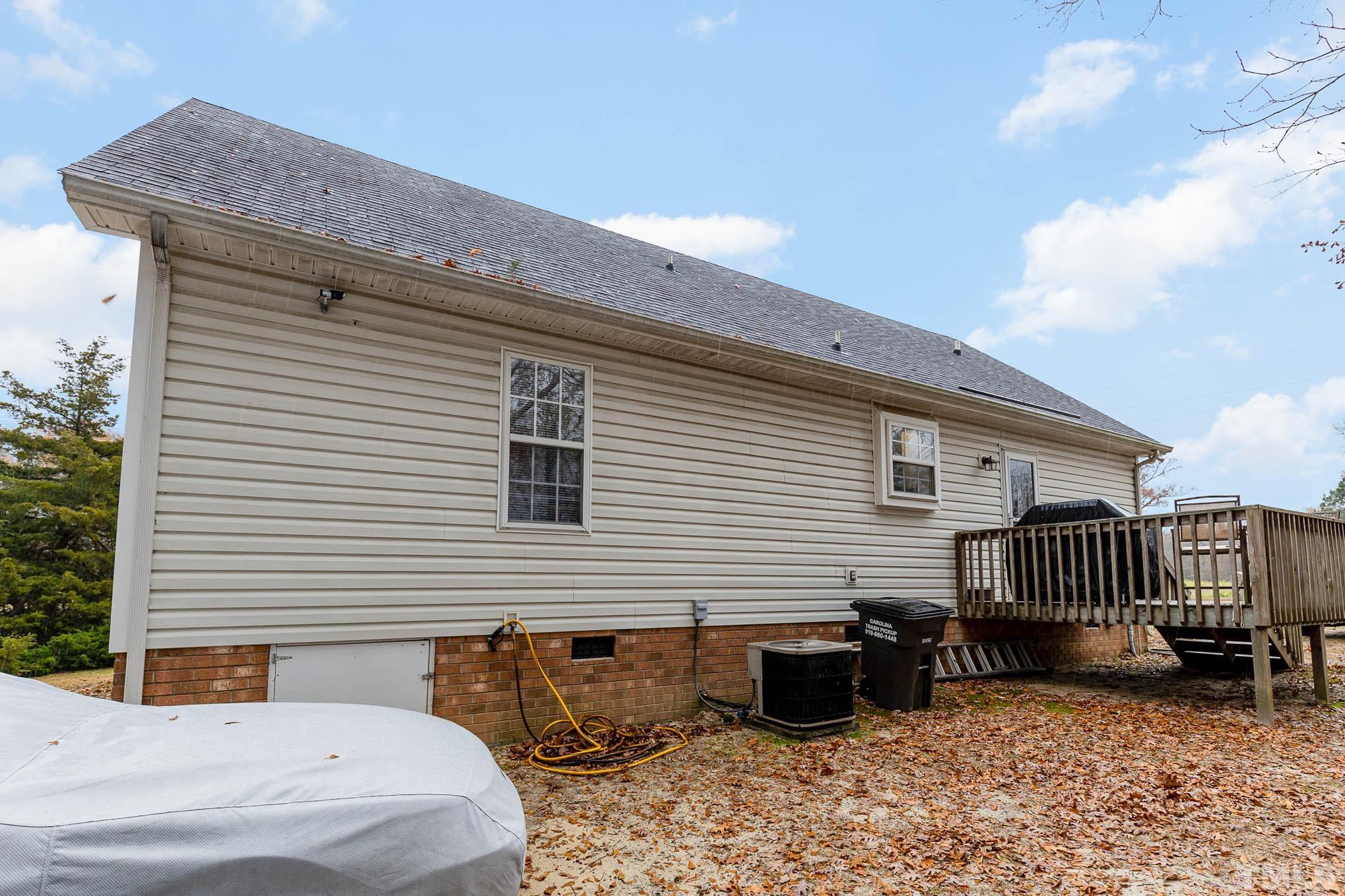 1371 Cobb Road Angier, NC 27501 - Photo 20 of 22 a backyard of a house with table and chairs