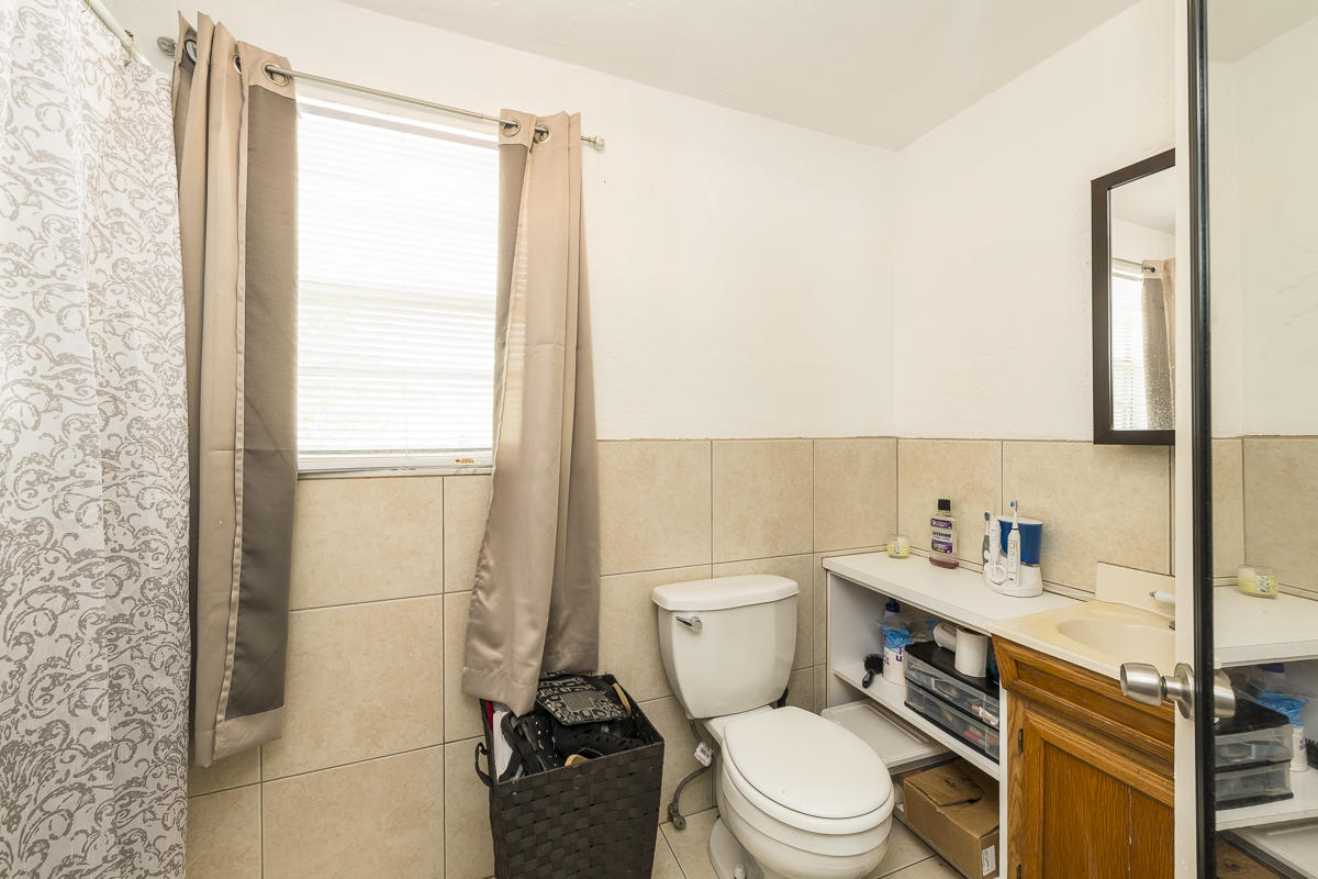 1821 Harris Avenue Key West, FL 33040 - Photo 26 of 27 a white toilet sitting next to a bathroom sink