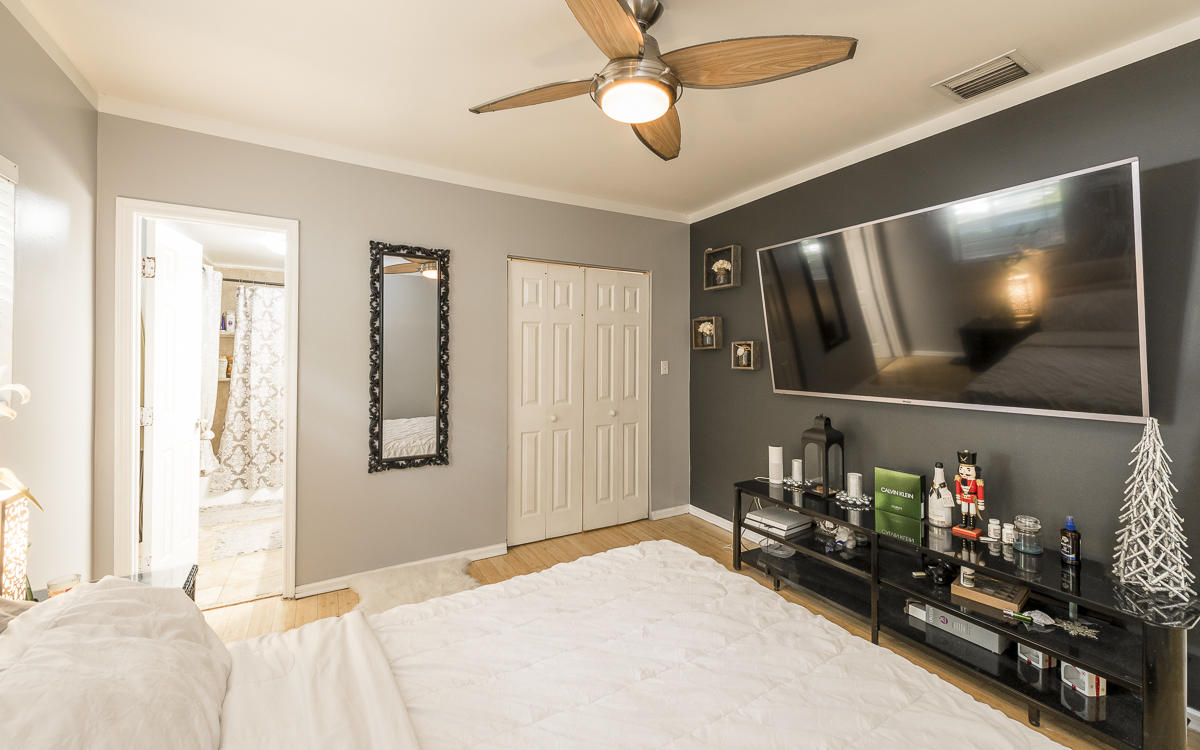 1821 Harris Avenue Key West, FL 33040 - Photo 7 of 27 a bedroom with filled bed and a flat tv screen