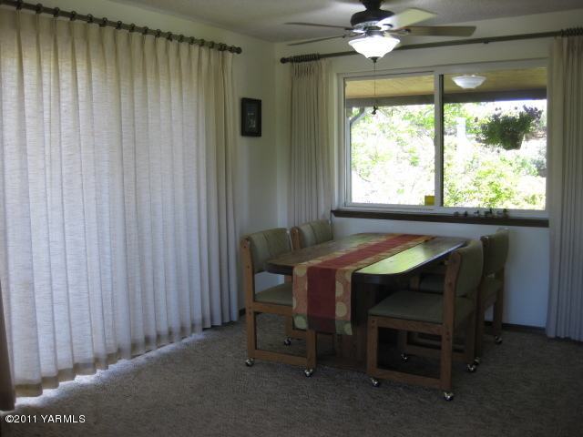 210 White Road Yakima, WA 98901 - Photo 12 of 63 a room with a table and chairs