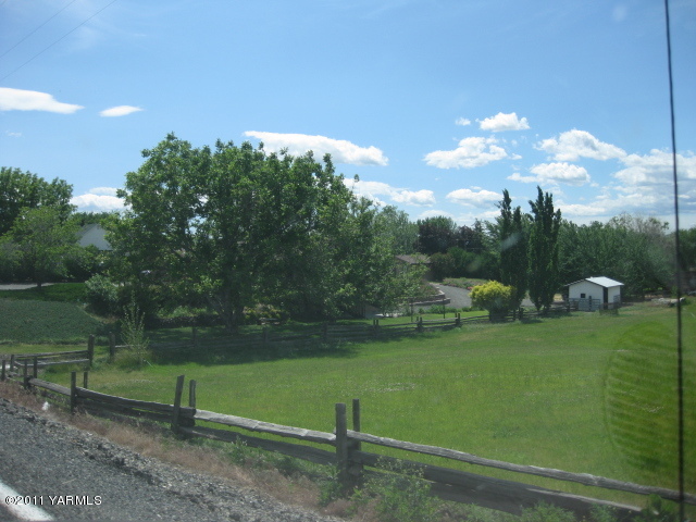 210 White Road Yakima, WA 98901 - Photo 57 of 63 a view of a lake with a yard