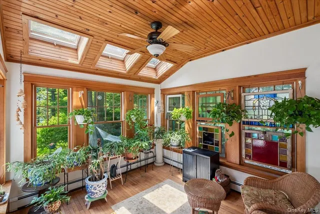a kitchen with sink a window and chairs