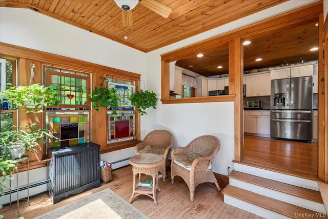 a dining room with furniture and wooden floor