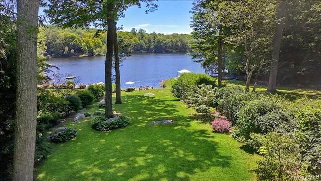 a view of a chair and table under an umbrella