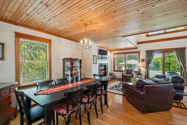 a living room with furniture a table and a large window