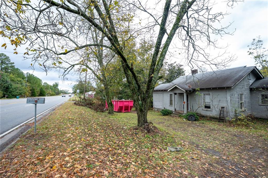 1401 Highway 41 Calhoun, GA 30701 - Photo 2 of 14 a view of a house with a yard and large tree