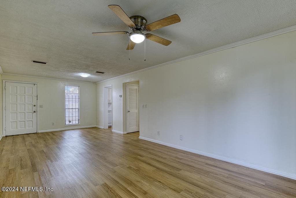 1768 El Camino Road, Unit 7 Jacksonville, FL 32216 - Photo 14 of 43 an empty room with wooden floor and windows