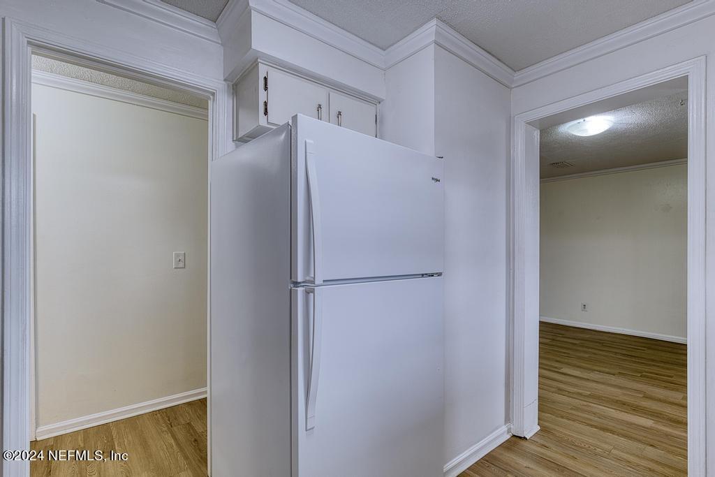 1768 El Camino Road, Unit 7 Jacksonville, FL 32216 - Photo 17 of 43 a view of walk in closet with wooden floor