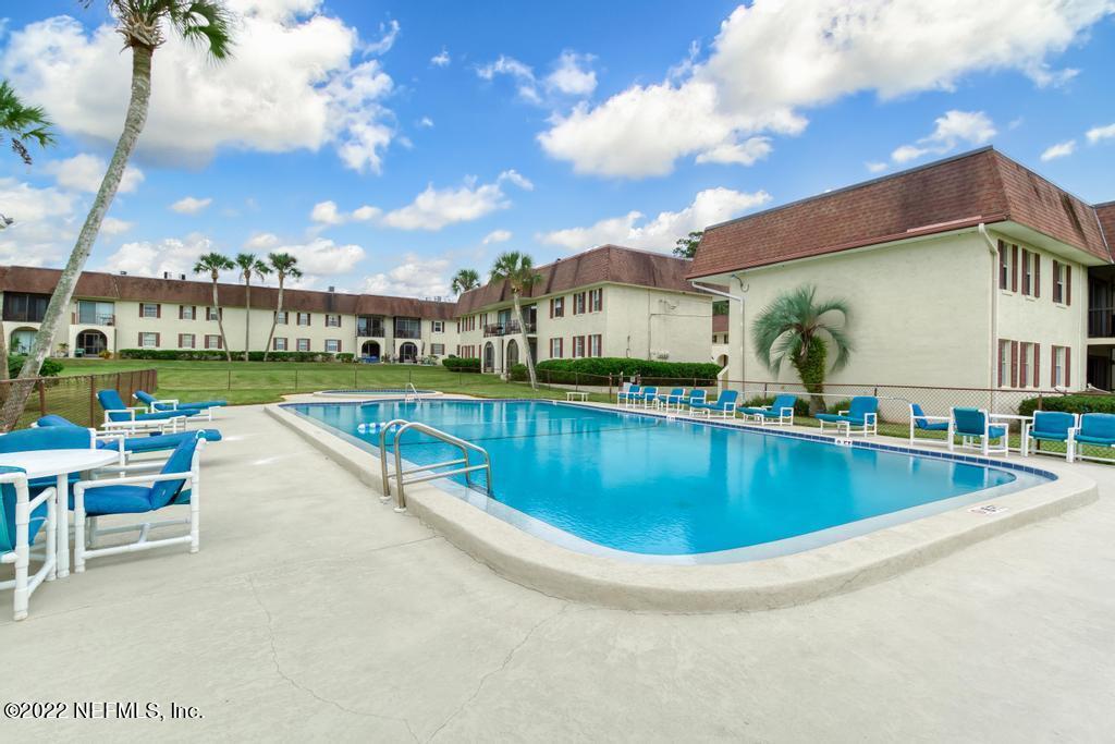 1768 El Camino Road, Unit 7 Jacksonville, FL 32216 - Photo 2 of 43 a view of a swimming pool with a patio
