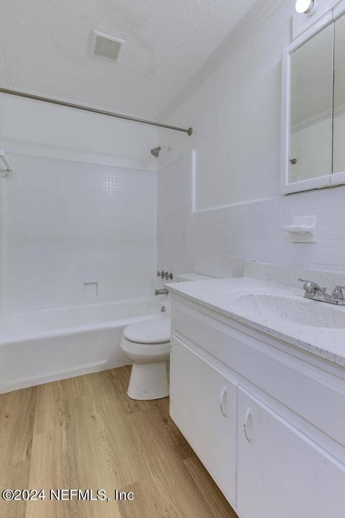 1768 El Camino Road, Unit 7 Jacksonville, FL 32216 - Photo 23 of 43 a bathroom with a toilet a sink and bathtub