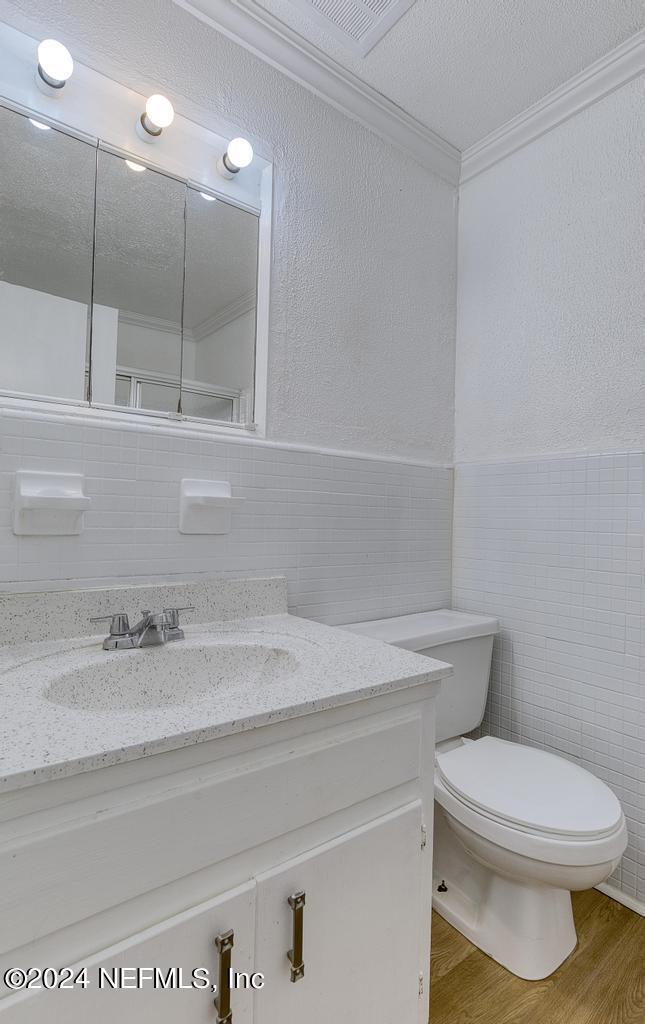 1768 El Camino Road, Unit 7 Jacksonville, FL 32216 - Photo 28 of 43 a bathroom with a sink a toilet and a mirror