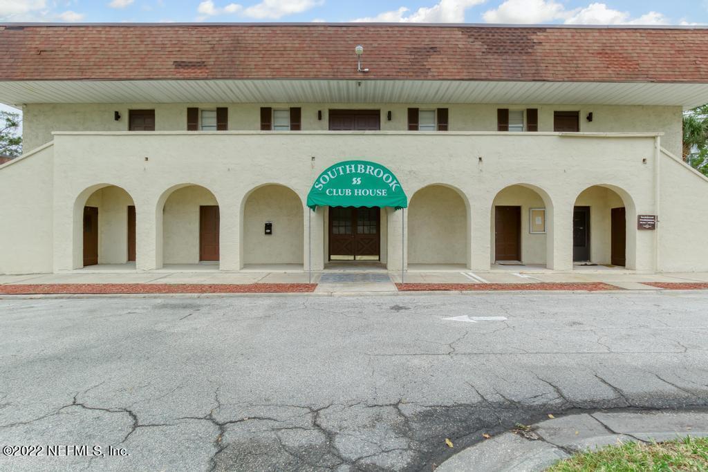 1768 El Camino Road, Unit 7 Jacksonville, FL 32216 - Photo 41 of 43 a front view of a house with garden